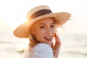 Woman wearing a hat at the beach