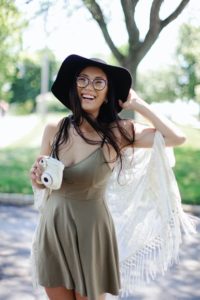 Smiling woman in hat on vacation